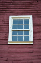 Old window on a wooden wall