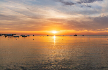 Obraz premium Beautiful red and orange sunrise over the sea.