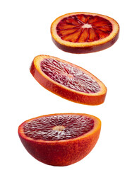 Slices of Blood Orange Falling Isolated on White.