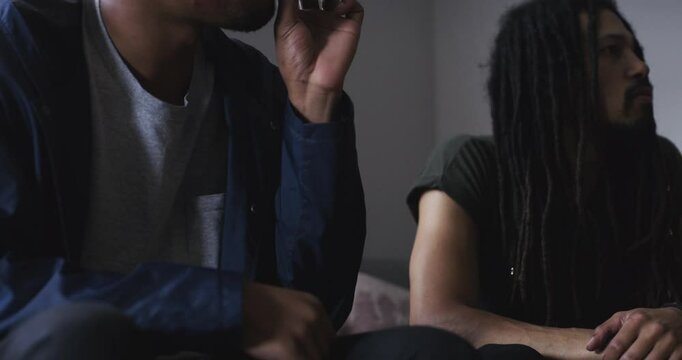 Cannabis joint, relax and people smoke blunt, marijuana or 420 CBD for cigarette habit, drugs or home wellness. Friends group, living room couch and rasta smoker smoking weed for illegal THC high