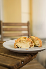 Close-up of a choux au craquelin french pastry or cream puff with pistachio filling cut in half