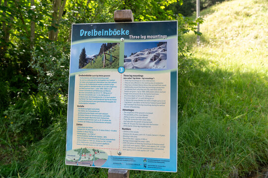Gimmewald, Switzerland - July 23, 2024: Informational sign in German and English about the Three Leg Mountain, on the Murren to Gimmelwald hiking trail