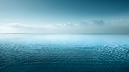 Obraz premium Calm Ocean Horizon Under Soft Blue Sky