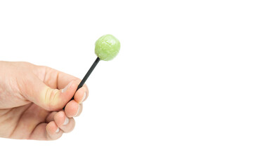 Male hand holding lollipop isolated on white background