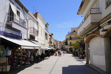 Fototapeta premium street with shops, restaurants and bars in the city centre of l'Estartit, holiday, vacation, Catalonia, Costa Brava, Barcelona, ​​​​Girona, Spain