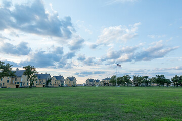 A beautiful sunset is captured surrounding the historic architecture of the buildings at Fort Hancock in Sandy Hook, New Jersey. Photo taken in August of 2024.
