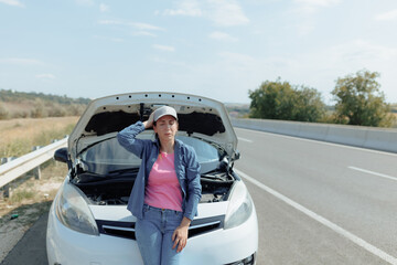 Distressed Woman Next to Broken Automobile on Motorway