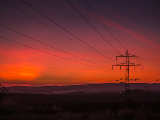 Electricity lines at dramatic sunset