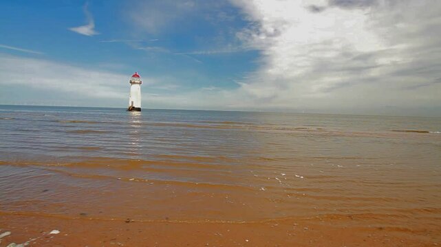The Point of Ayr or Talacre Lighthouse is on the north coast of Wales, UK, wide angle, copyspace to right