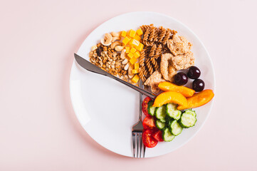 Concept individual meal plan by time food on plate on table top view