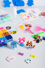 Aqua beads for the development of fine motor skills of children and the creation of decor vertical