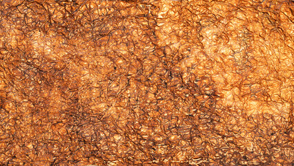 Abstract pattern created by crumpled and shiny copper colored foil