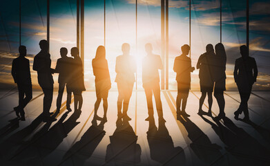 Double exposure image of many business people conference group meeting on city office building in background showing partnership success of business deal. Concept of teamwork, trust and agreement. uds