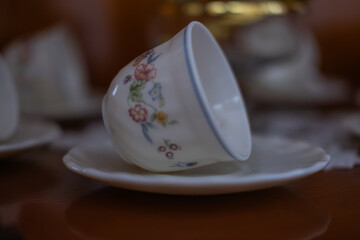 Traditional turkish coffee cup on white lace