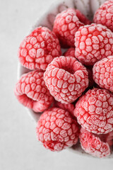 frozen raspberries in a grey bowl