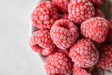 frozen raspberries in a grey bowl