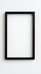 Close-up empty black frame on minimalist white background