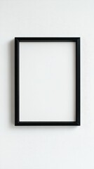 Close-up empty black frame on minimalist white background