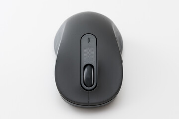 Black computer mouse on the blue background.
