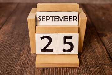 September 25 calendar date text on wooden blocks with copy space for ideas or text.