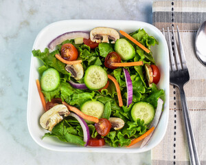 salad of  cucmbers, tomatoes  onions and mushrooms
