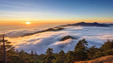 Obraz premium The view at the top of the mountain is covered in clouds