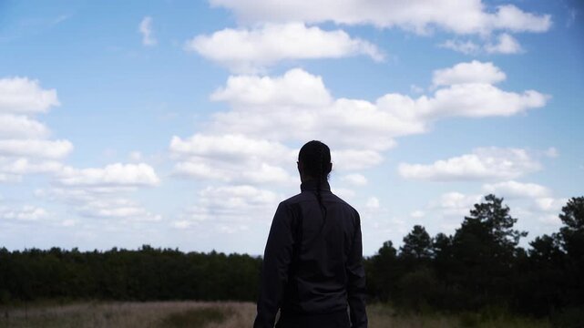 silhouette of a person taking a picture in slow motion