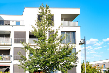 Contemporary residential buildings, community with lush greenery, modern architecture and well-maintained landscape, New apartment buildings