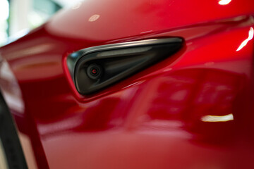 side camera car Close-up, showcasing innovative design and advanced features, driving safety electric vehicle, Technological marvel, AI sensor