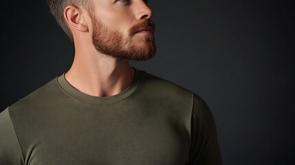 Fototapeta premium Adventurous Man Wearing Olive Green Shirt in Three-Quarter Body Shot with Textured Details on Charcoal Background