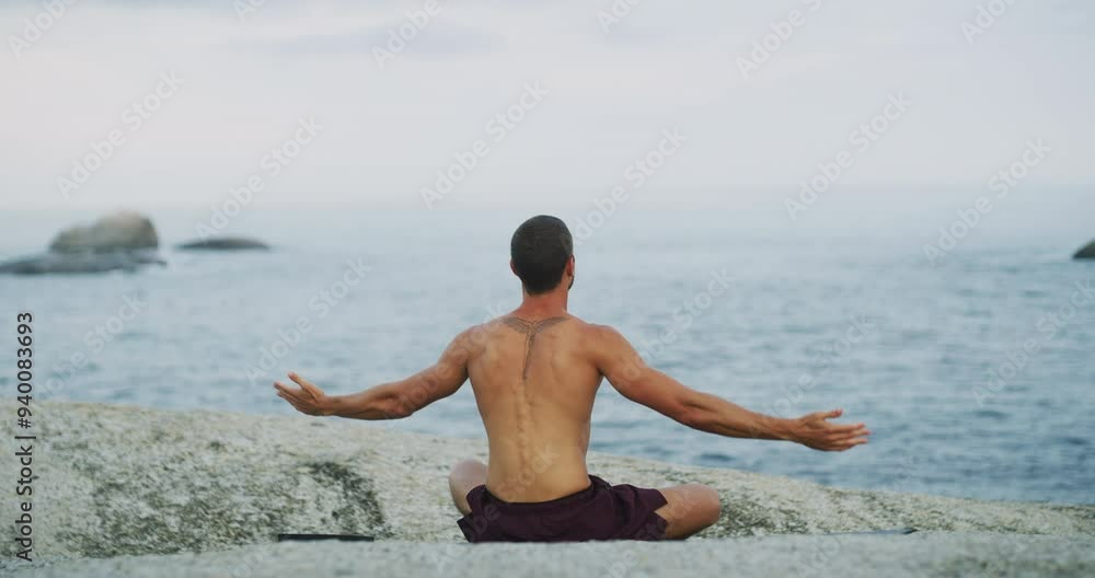 Wall mural Beach, zen and man doing meditation exercise for calm mindset, wellness and health. Nature, meditation and back of calm male person doing yoga workout by the ocean or sea for spirit and body balance.