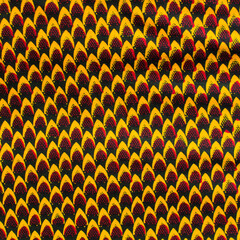 top view of red yellow ankara fabric, flatlay of nigerian wax cloth with designs, spread out red yellow ankara material