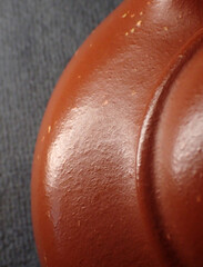 Closeup of a purple clay teapot, traditional Chinese tea culture