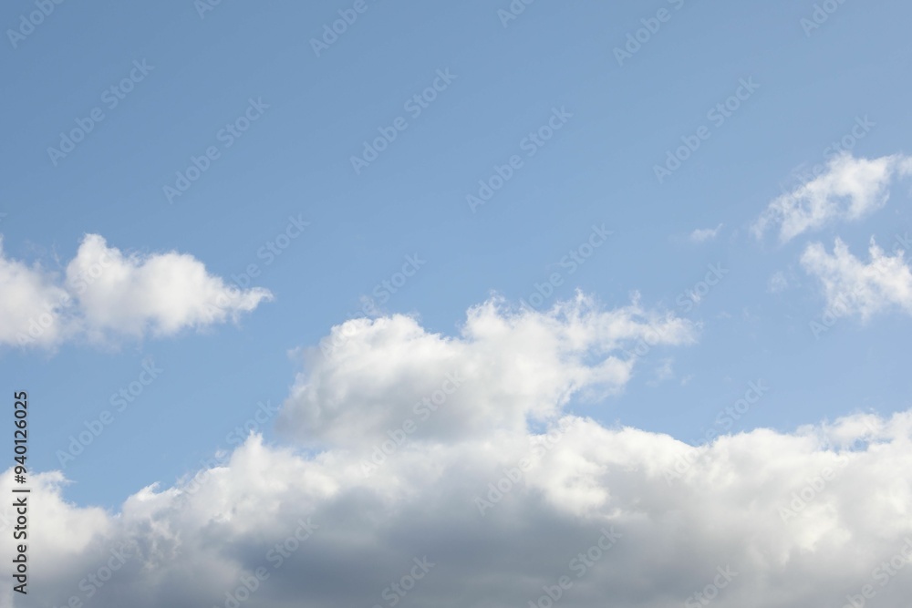 Wall mural picturesque view of blue sky with fluffy clouds