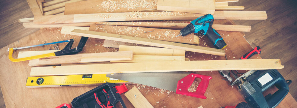 Banner DIY craftsperson wood heap carpenter objects woodwork handyman desk. Banner Architect carpentry tools home improvement equipments. Wooden carpenter construction workshop with copy space