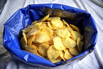 Ridged potato chips isolated on white background