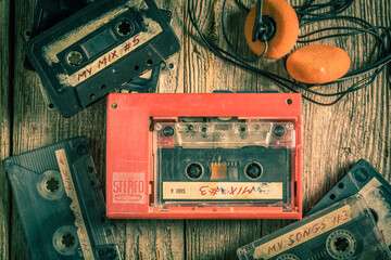 Vintage and old cassette tape with portable player and headphones