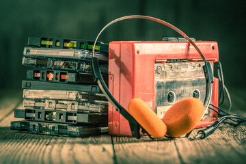 Cassette tape with old portable player and headphones