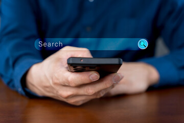 Close-up of hand a man using a mobile phone search for information interest on search engine website