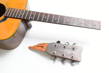 part of broken wood acoustic guitar isolated on white background