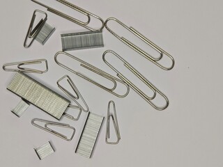 a scattered cluster of paper clips, showcasing their various shapes and sizes