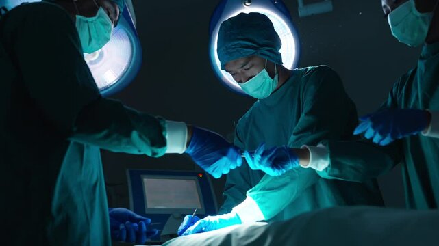 Professional surgeon doctor and nurse in surgical uniform performing surgical to patient in hospital operating room or plastic surgery clinic. Specialized medical center and health insurance concept.