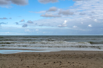 View of the incoming wave on the Baltic Sea on the shore of the Curonian Spit on a summer day,...