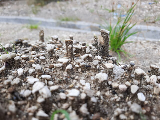 Natural soil texture is formed due to rain falling on the ground and leaving gravel like debris.