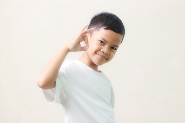 Image of Asian child posing on white background.