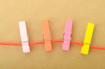 The image of clothespins on a string beautifully symbolizes the interconnectedness of different...