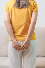 Woman having Abdominal pain. Hemorrhoids disease Constipation, Colorectal cancer. Digestive system,...