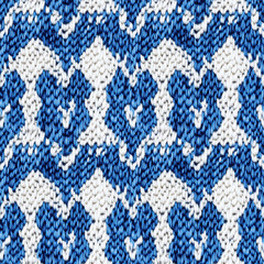 Seamless blue and white knitted houndstooth pattern with textured yarn design