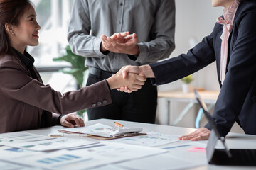 Business handshake for teamwork of business merger and acquisition,successful negotiate,hand shake,two businessman shake hand with partner to celebration partnership and business deal concept
