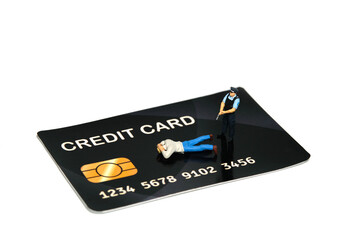 Miniature people toy figure photography. A policeman catches credit card fraudsters. Isolated on...